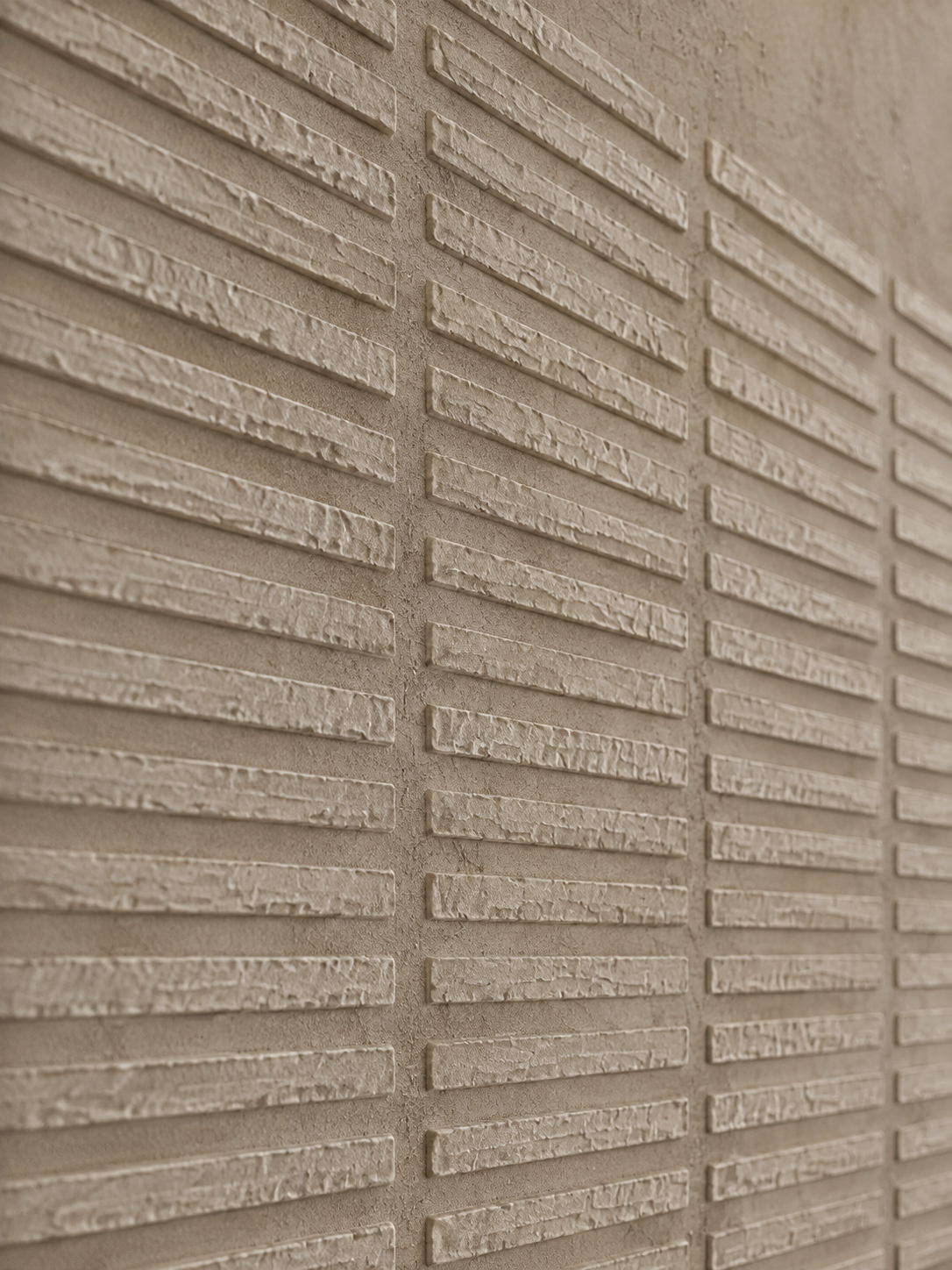 An angled close-up of a textured abstract painting, showing raised surface detail.